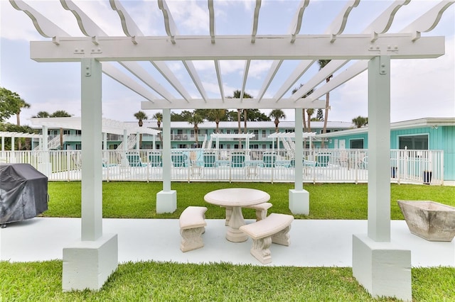 view of patio featuring grilling area and a pergola