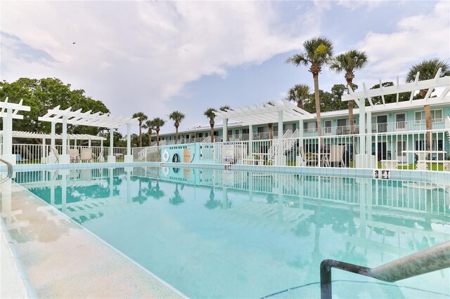 view of swimming pool with a pergola