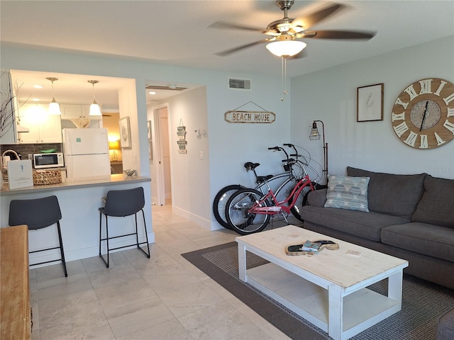 living room featuring ceiling fan