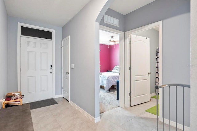 entrance foyer featuring light tile patterned floors