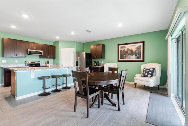 dining area featuring light hardwood / wood-style flooring