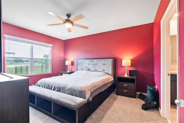 carpeted bedroom with ceiling fan