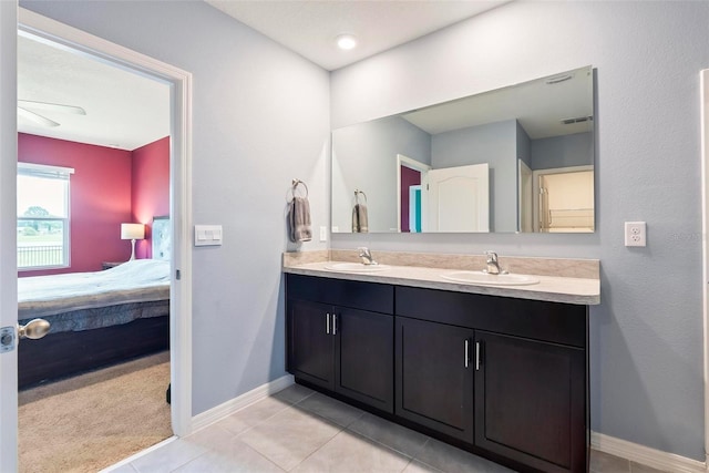 bathroom with vanity and tile patterned flooring