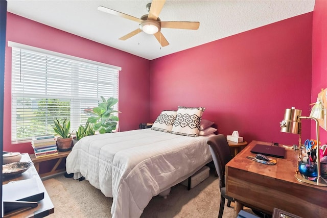 bedroom featuring ceiling fan and carpet flooring