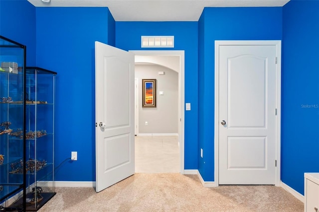 unfurnished bedroom featuring light colored carpet