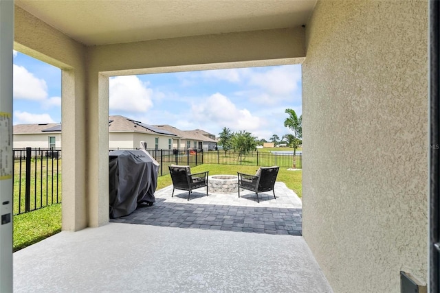 view of patio featuring grilling area and an outdoor fire pit