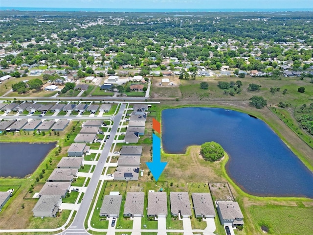 birds eye view of property featuring a water view