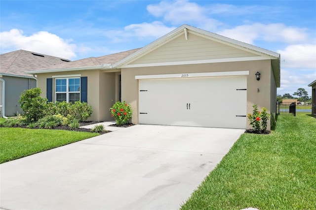 single story home with a garage and a front lawn