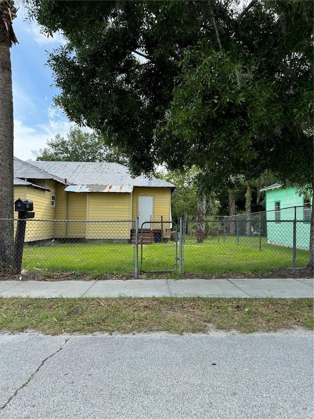 view of side of property with a yard