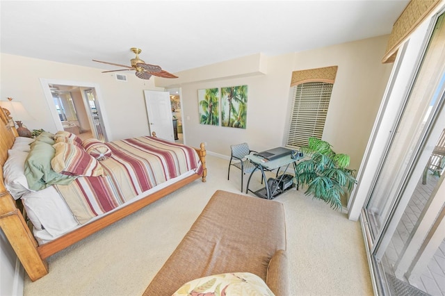 bedroom featuring multiple windows, carpet floors, ensuite bath, and ceiling fan