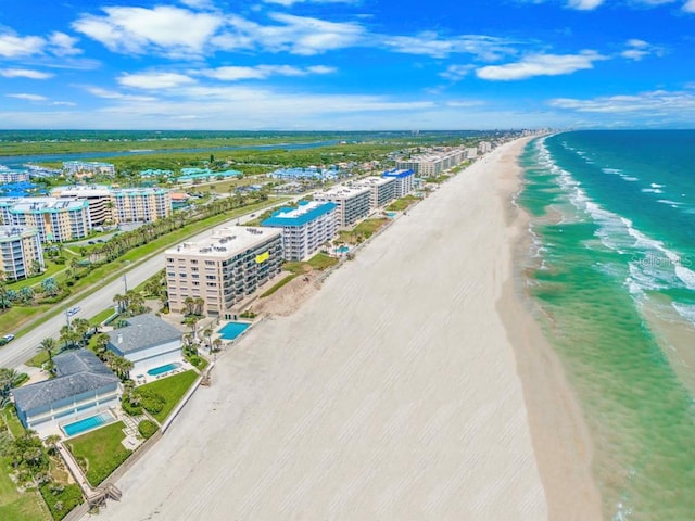 bird's eye view with a view of the beach and a water view