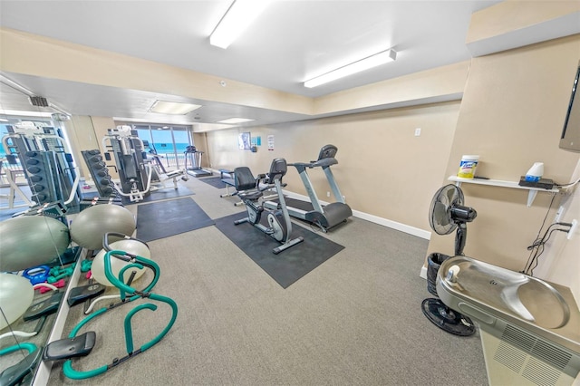 gym with dark colored carpet