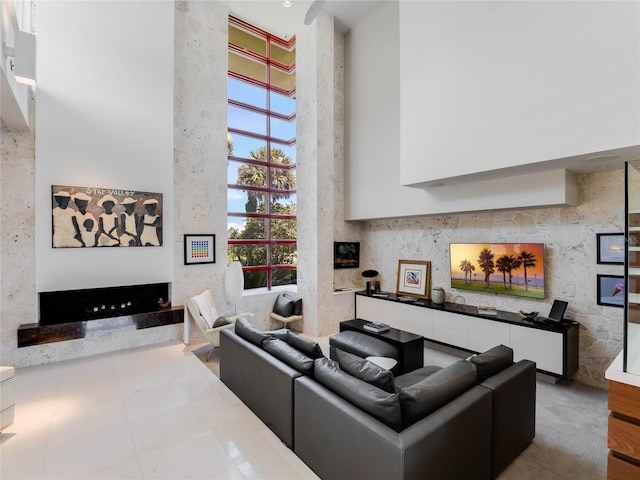 living room featuring a high ceiling