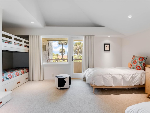 carpeted bedroom with vaulted ceiling