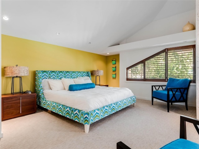 bedroom featuring carpet and lofted ceiling