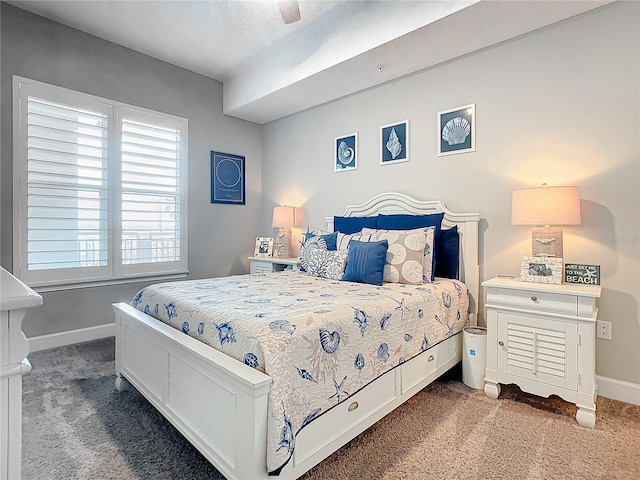 carpeted bedroom with baseboards and ceiling fan