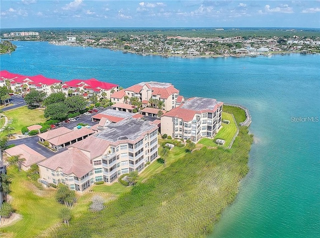 birds eye view of property with a water view