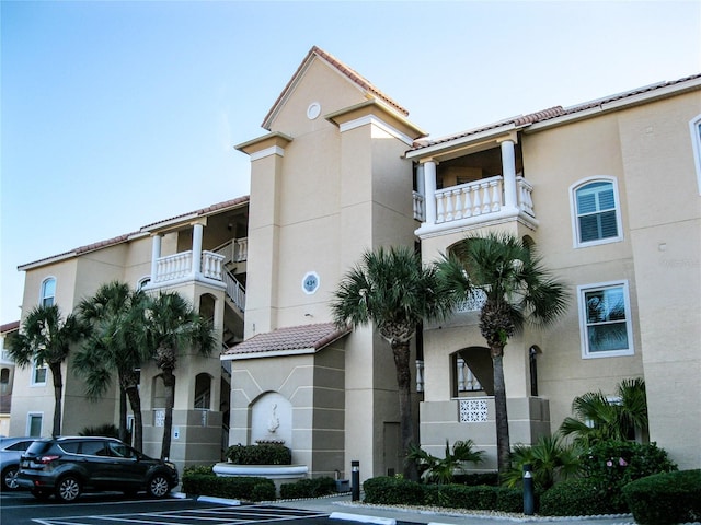 434 Bouchelle Dr Unit 304, New Smyrna Beach, FL 32169 - view of building exterior with uncovered parking
