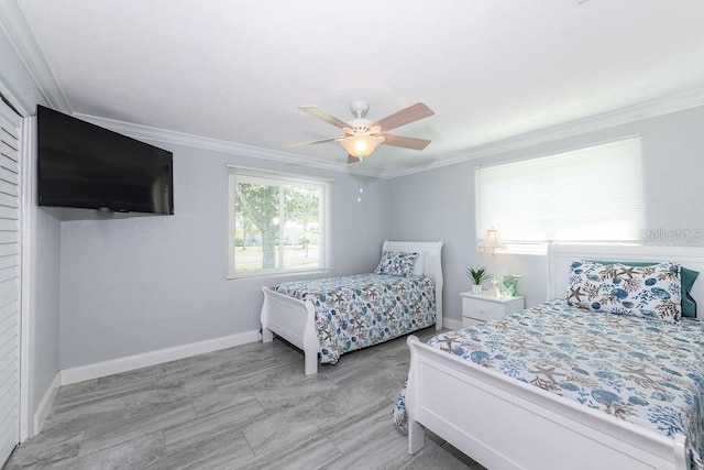 bedroom with ceiling fan and ornamental molding