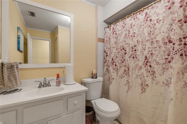 bathroom featuring vanity, toilet, and walk in shower