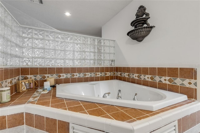 bathroom with tiled tub