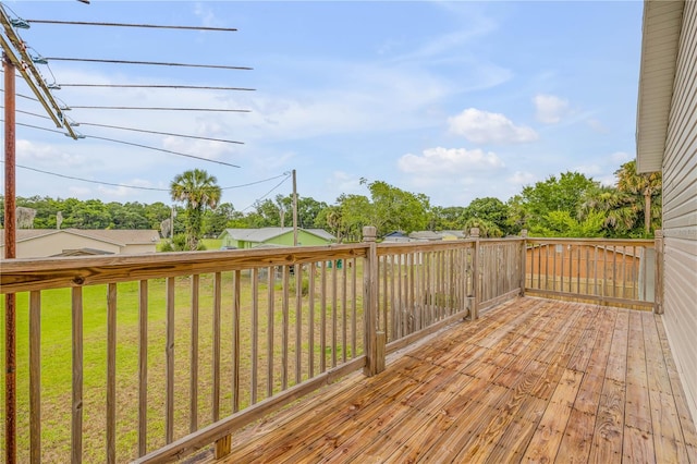 wooden deck with a lawn