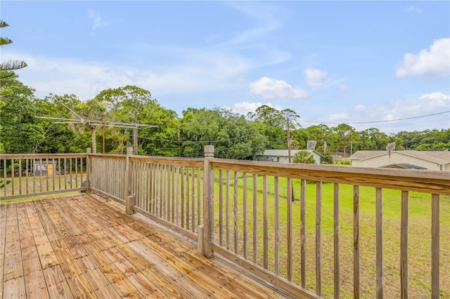 wooden deck with a lawn