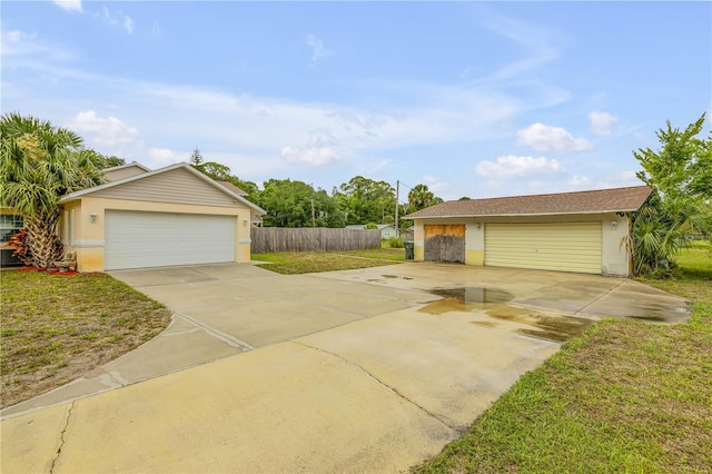 view of front facade featuring a front yard and a garage