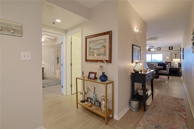 hall with light hardwood / wood-style floors