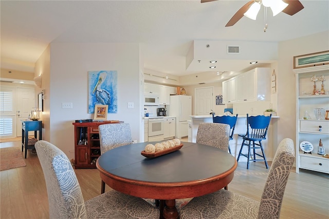 dining area featuring ceiling fan and light hardwood / wood-style floors