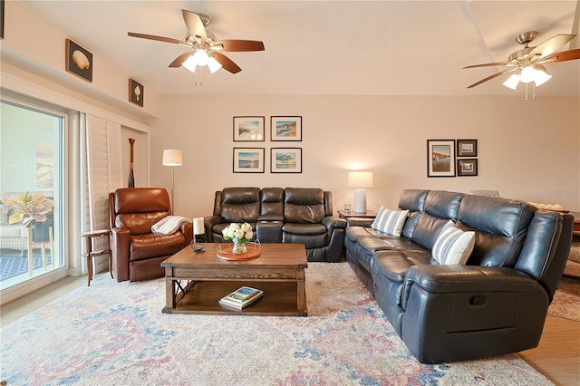 living room featuring hardwood / wood-style flooring and ceiling fan