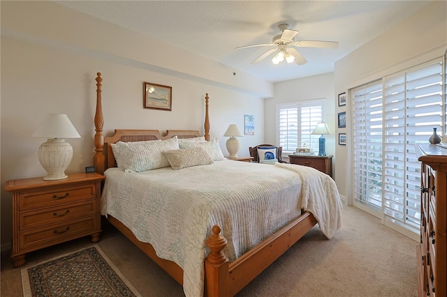 bedroom featuring ceiling fan, access to exterior, and light carpet