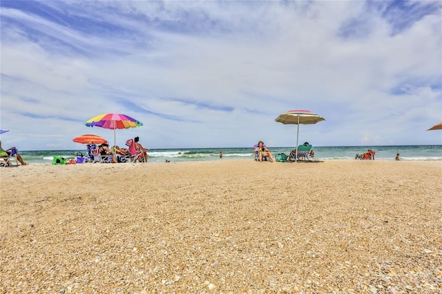 property view of water featuring a beach view