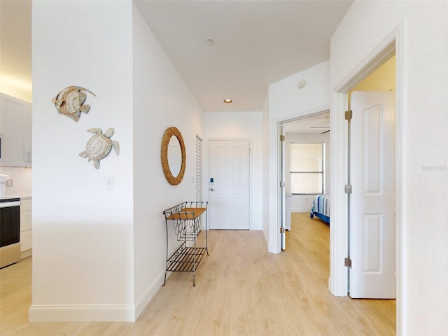 hallway featuring light hardwood / wood-style floors