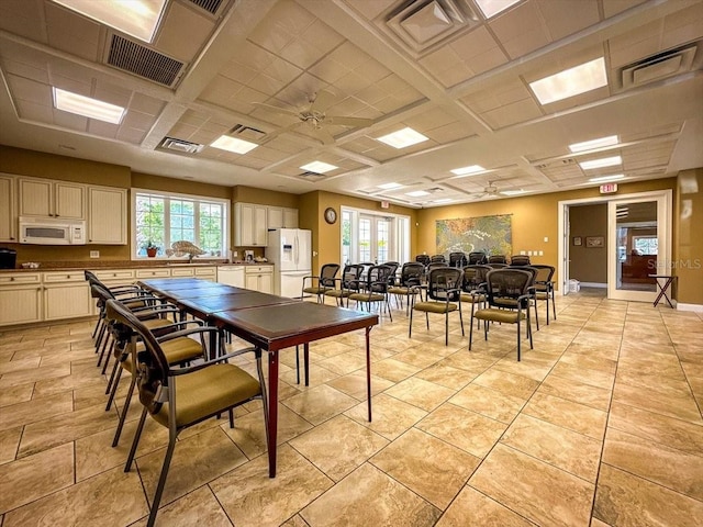 tiled dining area featuring ceiling fan