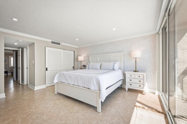 bedroom with a closet and ornamental molding