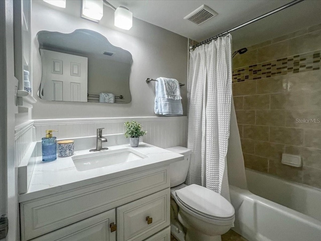 full bathroom featuring vanity, toilet, and shower / bath combo with shower curtain