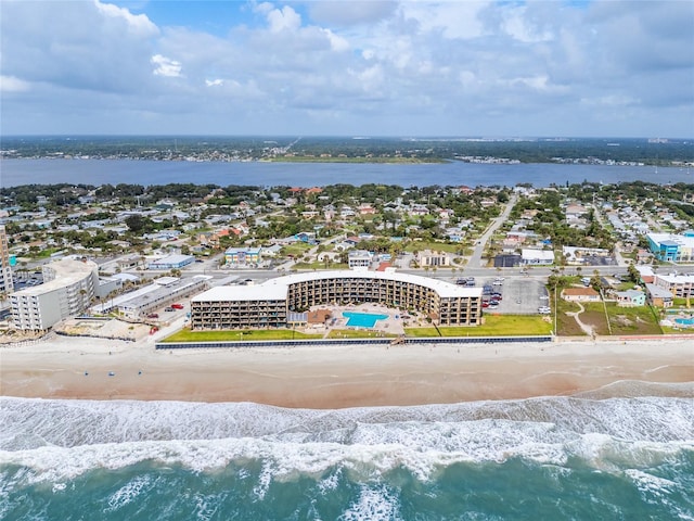 aerial view featuring a water view and a beach view