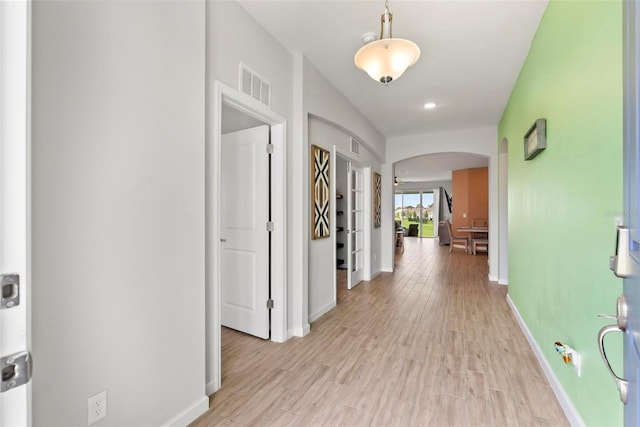 hallway with light wood-type flooring