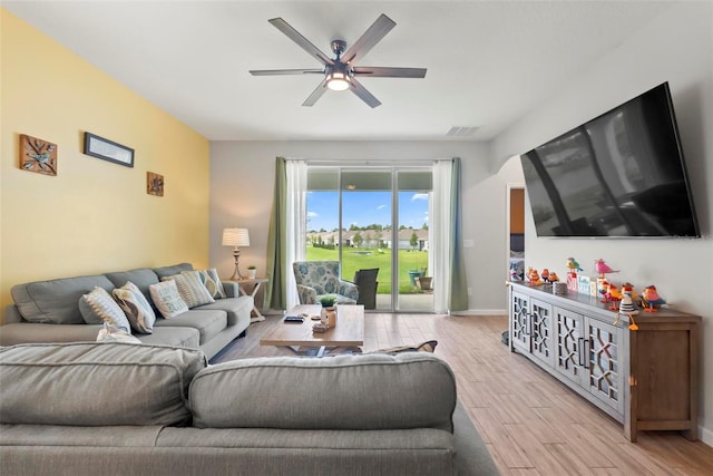 living room featuring ceiling fan