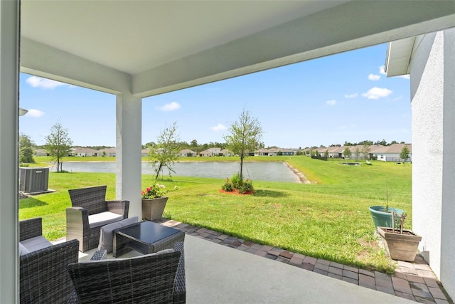 view of patio featuring central air condition unit and a water view