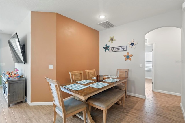 dining area featuring light wood-type flooring