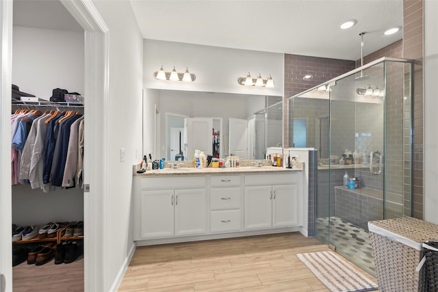 bathroom with vanity and walk in shower