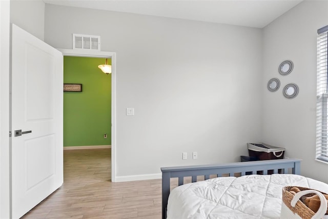 bedroom with light hardwood / wood-style flooring