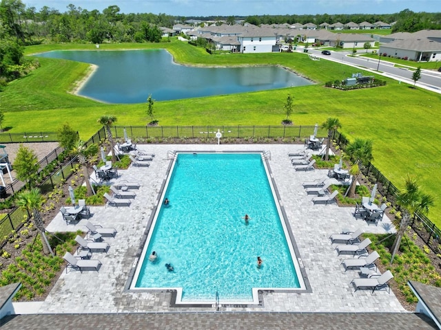 view of swimming pool with a water view