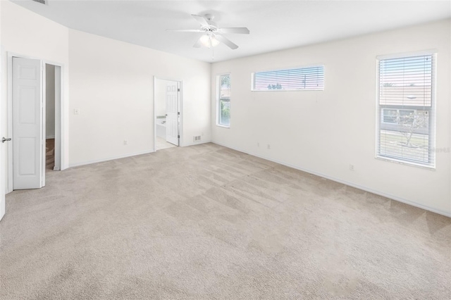 unfurnished room with light carpet and ceiling fan