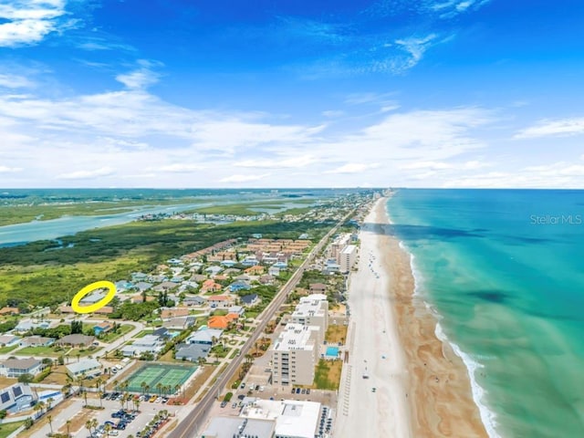 aerial view with a beach view and a water view