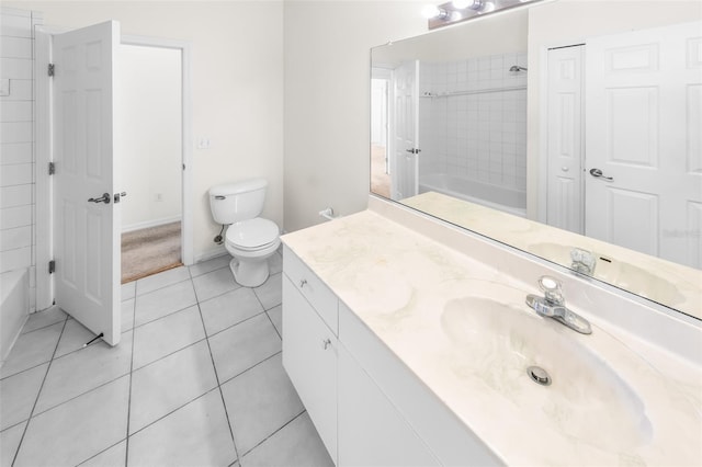 bathroom featuring toilet, tile patterned flooring, vanity, shower / washtub combination, and a closet