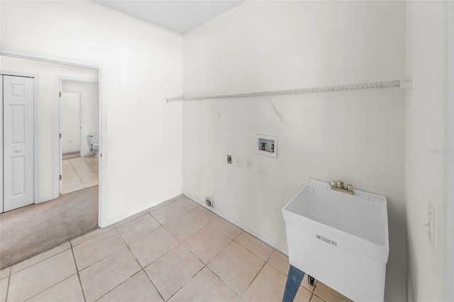 laundry room featuring washer hookup, hookup for an electric dryer, a sink, light carpet, and laundry area