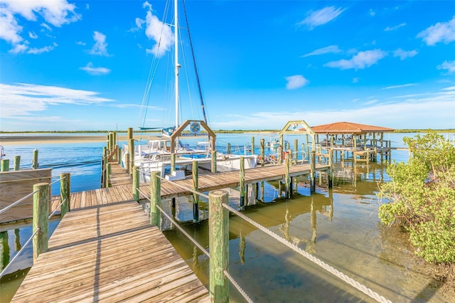 view of dock featuring a water view and boat lift